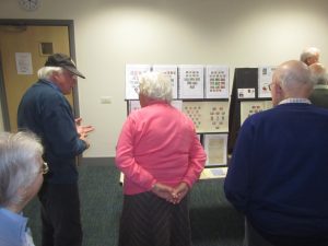 NPS Members inspecting the displays