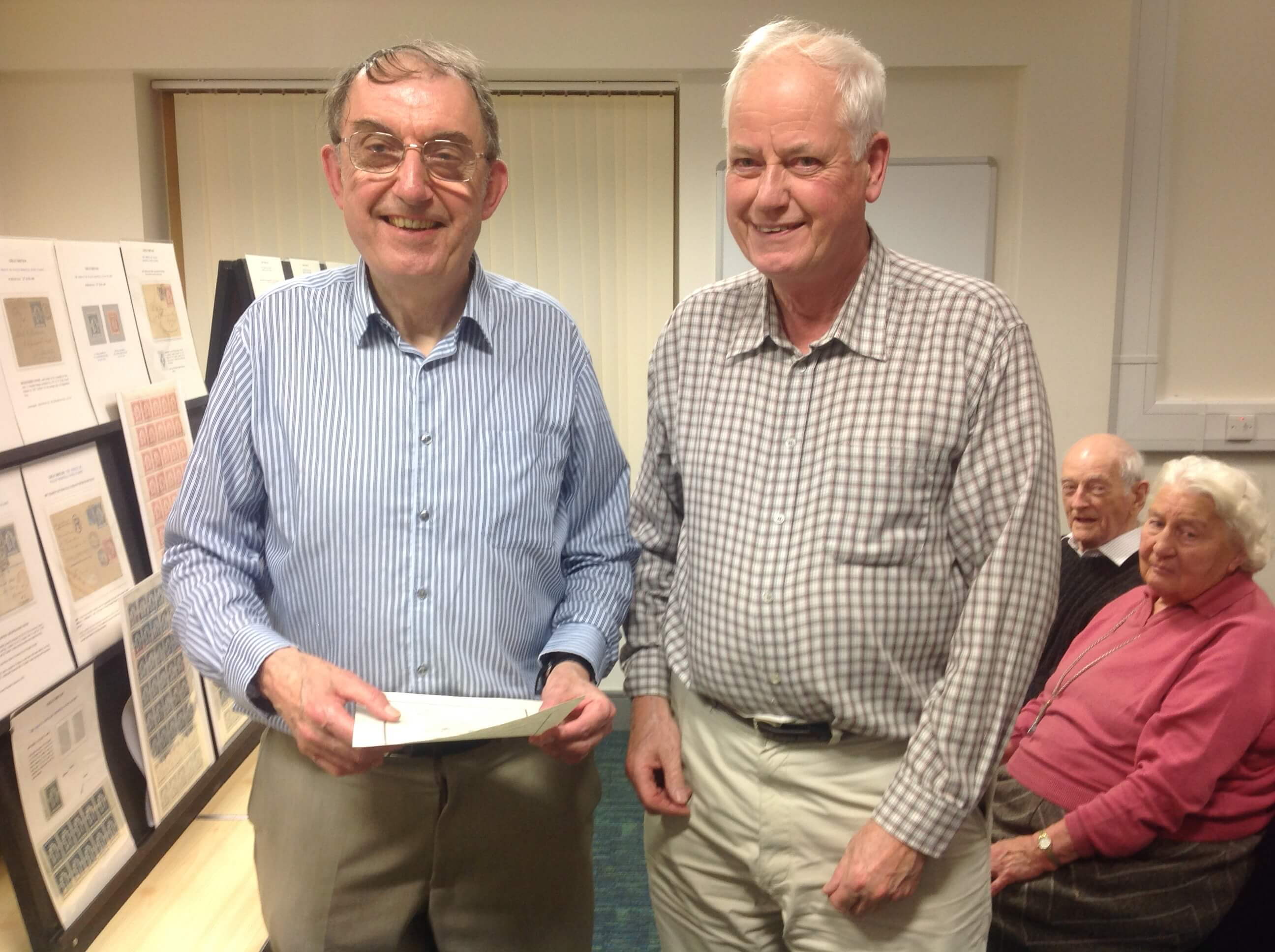 Dr David Sigee being presented with a certificate by Nick Rolfe