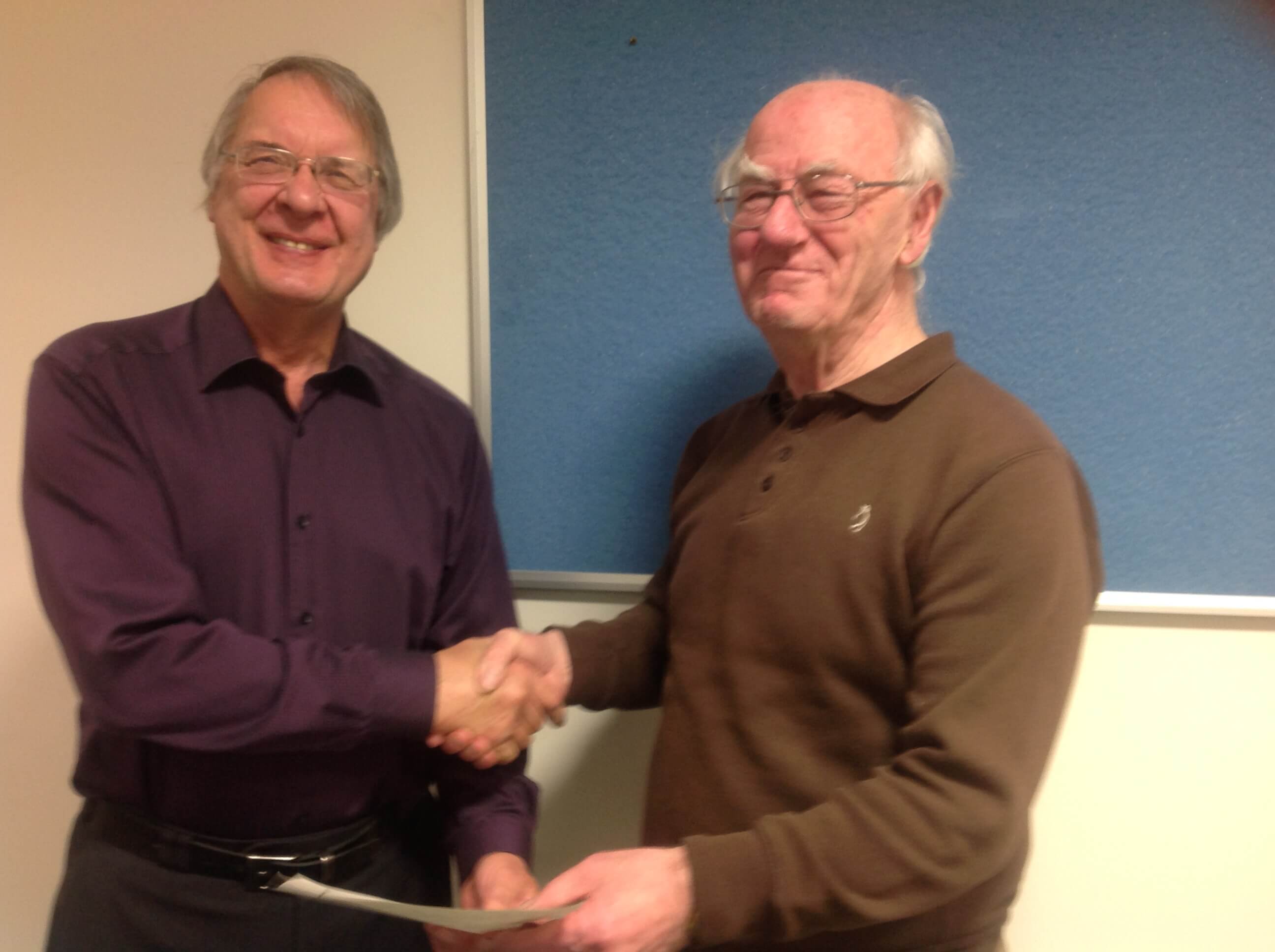 John Mayne receives a certificate from Graham Macpherson for his display