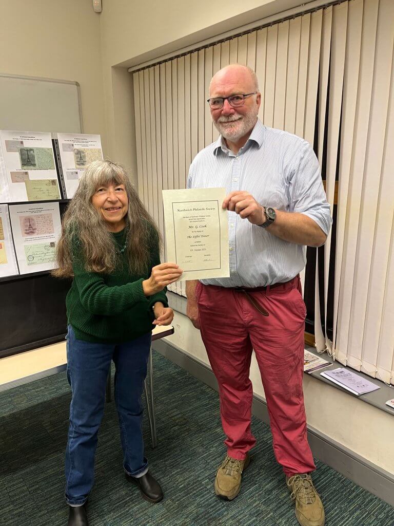 Carol Slater gives a certificate of thanks to Dr Gary Cook | Northwich Philatelic Society