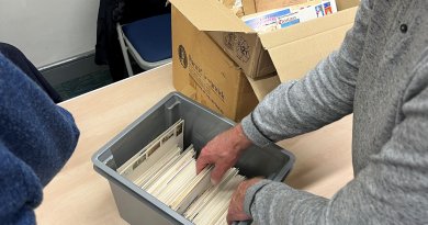 Members viewing boxes of material for sale at the Northwich Philatelic Society AGM 2023