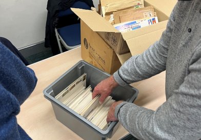 Members viewing boxes of material for sale at the Northwich Philatelic Society AGM 2023