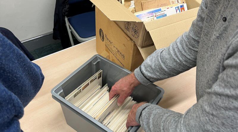 Members viewing boxes of material for sale at the Northwich Philatelic Society AGM 2023